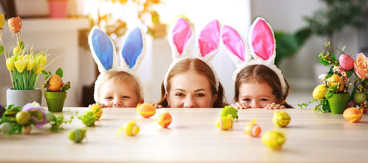 family peeking over counter with bunny ears